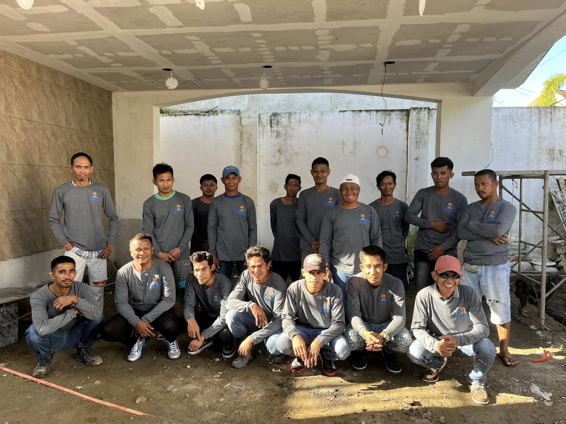 The COREN site team photographed together on a project