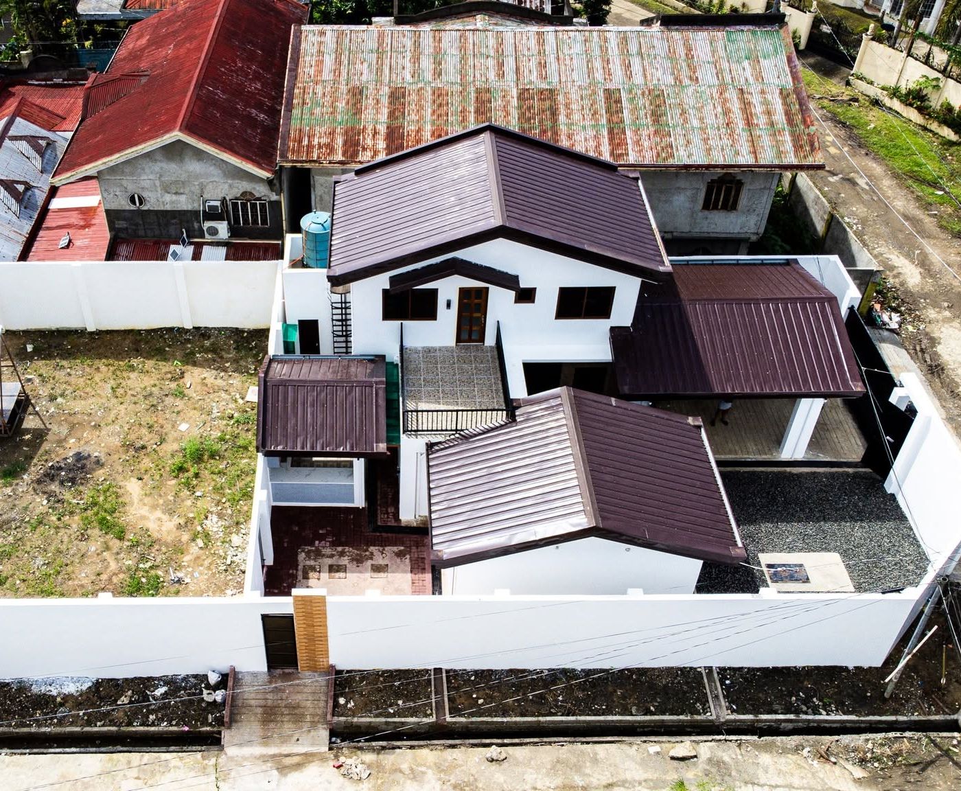 Aerial view of a completed two-storey residence, Fulgencio Subdivision, Calbayog City