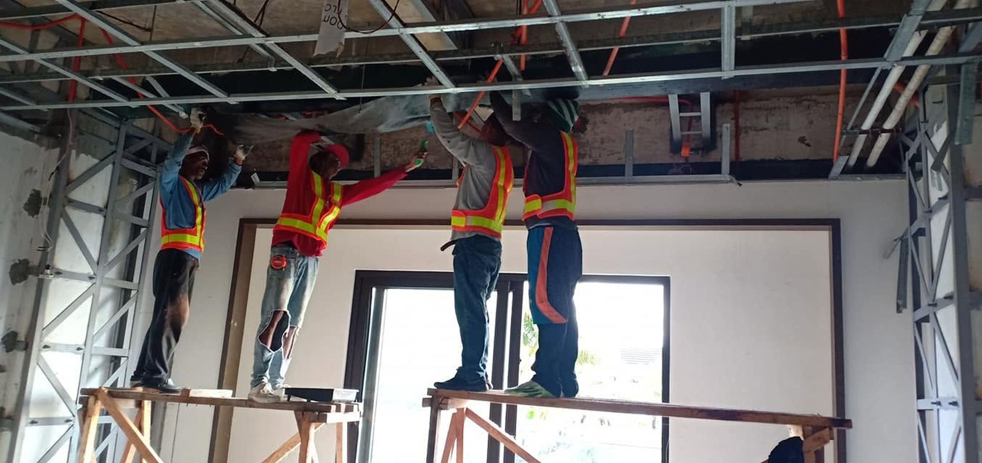 COREN crew installing ceiling framing on site